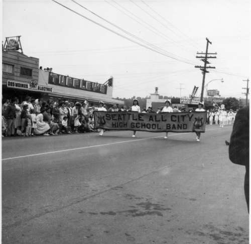 Des Moines Electric, Tuffley's Market and Dugout Tavern Behind Seattle All City High School Band in Parade