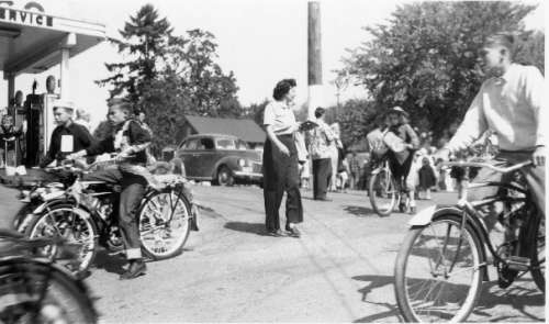 Bicycles in a Parade by Del's Texaco